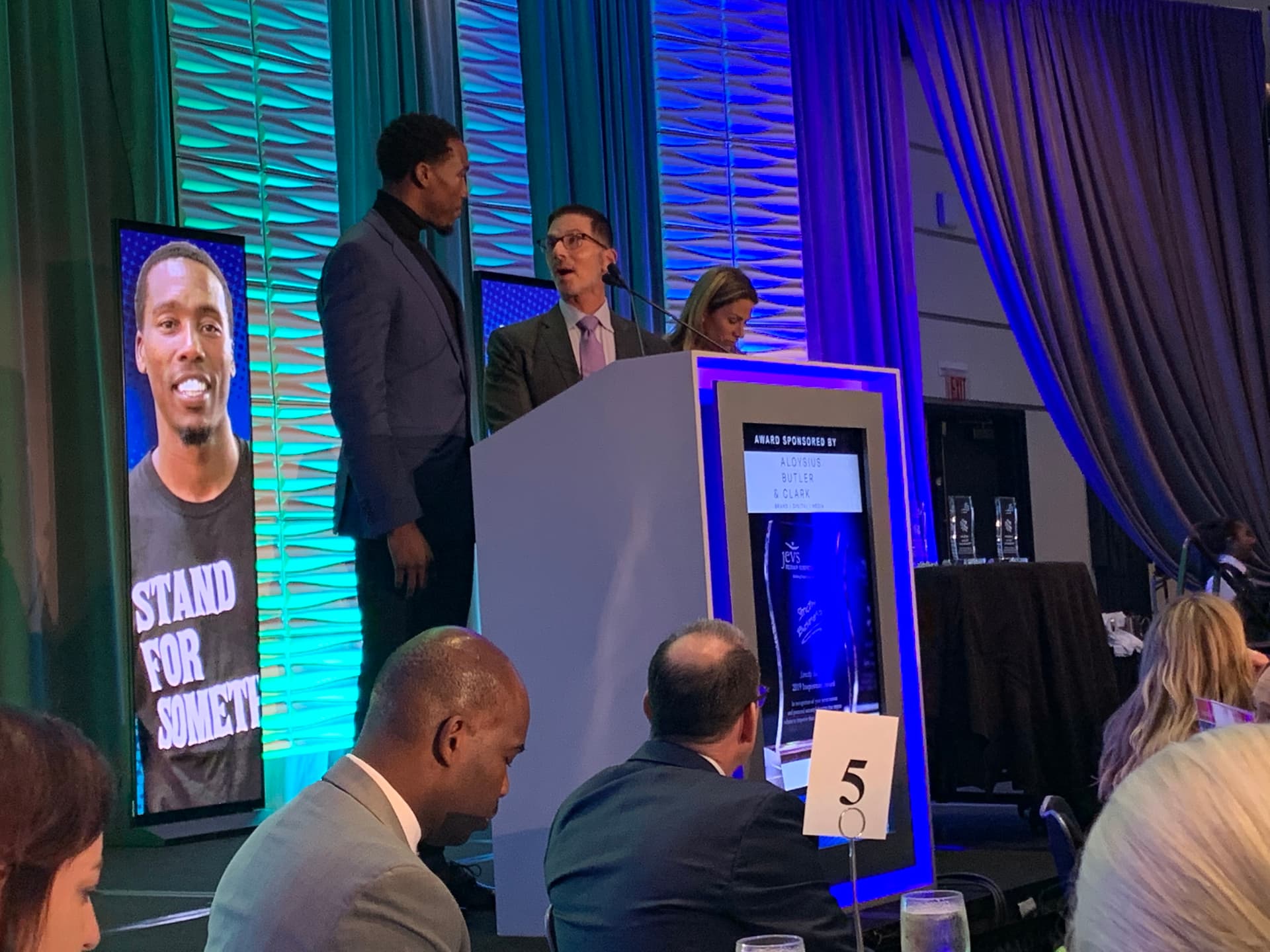 Tasheed Carr on stage at the JEVS Strictly Business Inspiration Award ceremony