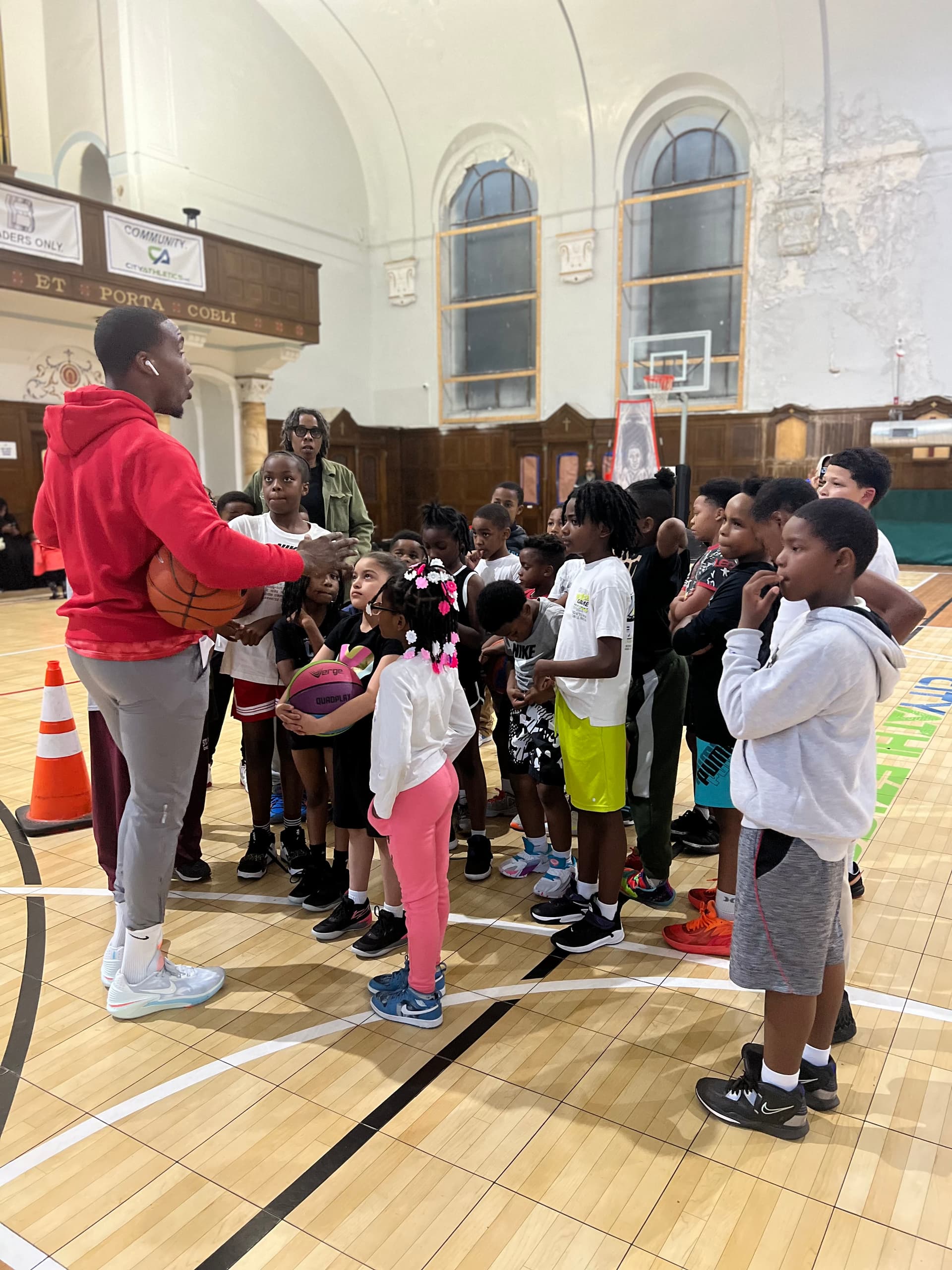 Tasheed Carr coaching boys and girls at a Born Leader Family basketball clinic