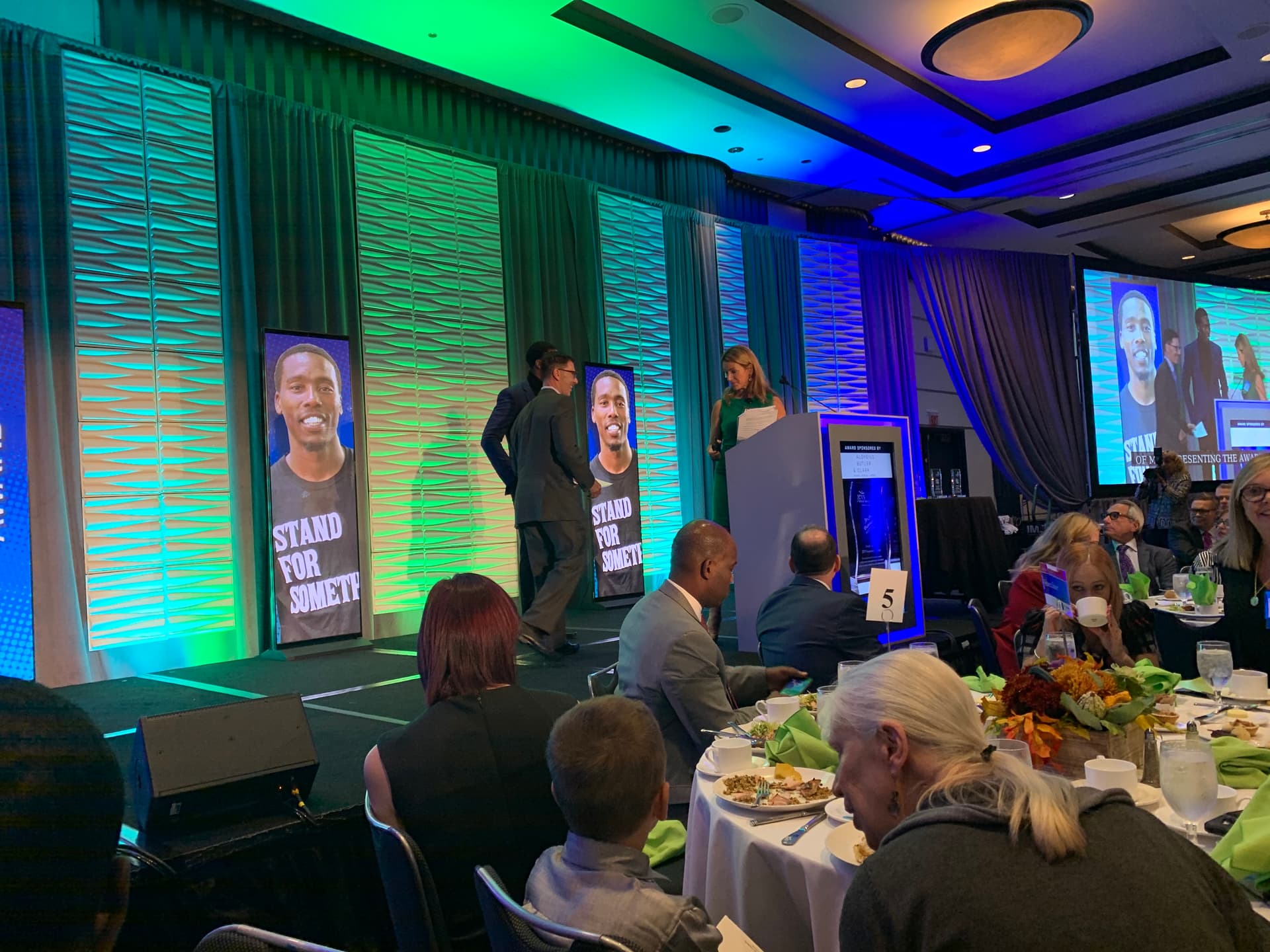 Born Leader Family 'Stand For Something' banners displayed at the JEVS awards gala stage